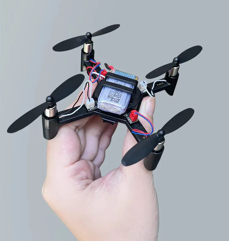 Assembled Mini STEM quadcopter held in one hand to show its compact size
